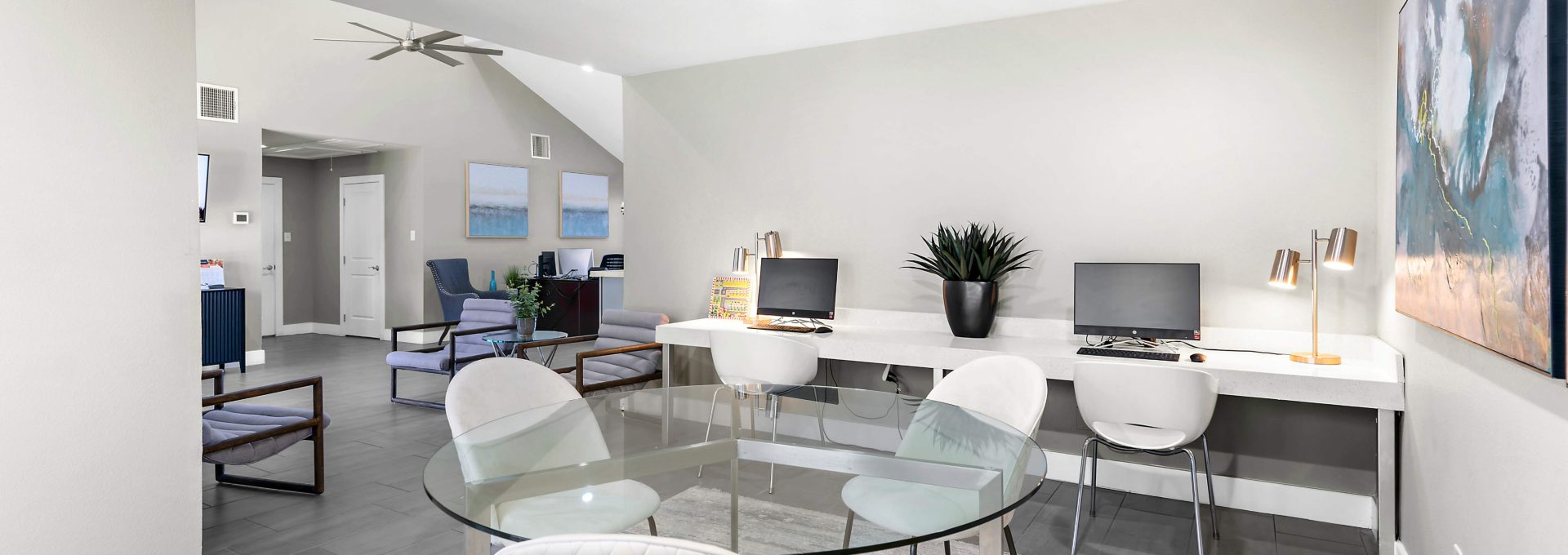 a clean and modern living room with a dining table at The Sonoma Apartments